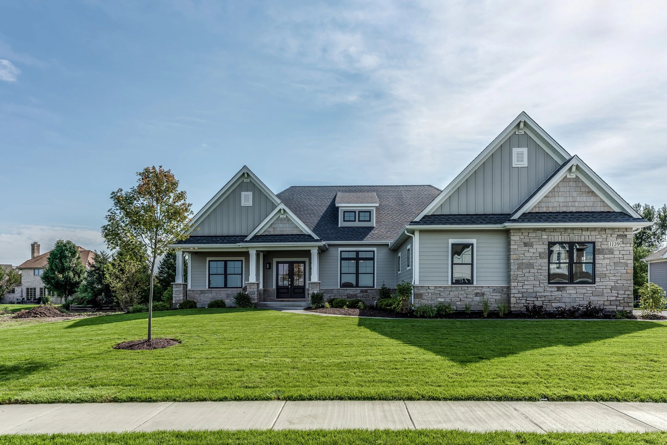 New home exterior in a neighborhood (concept example)