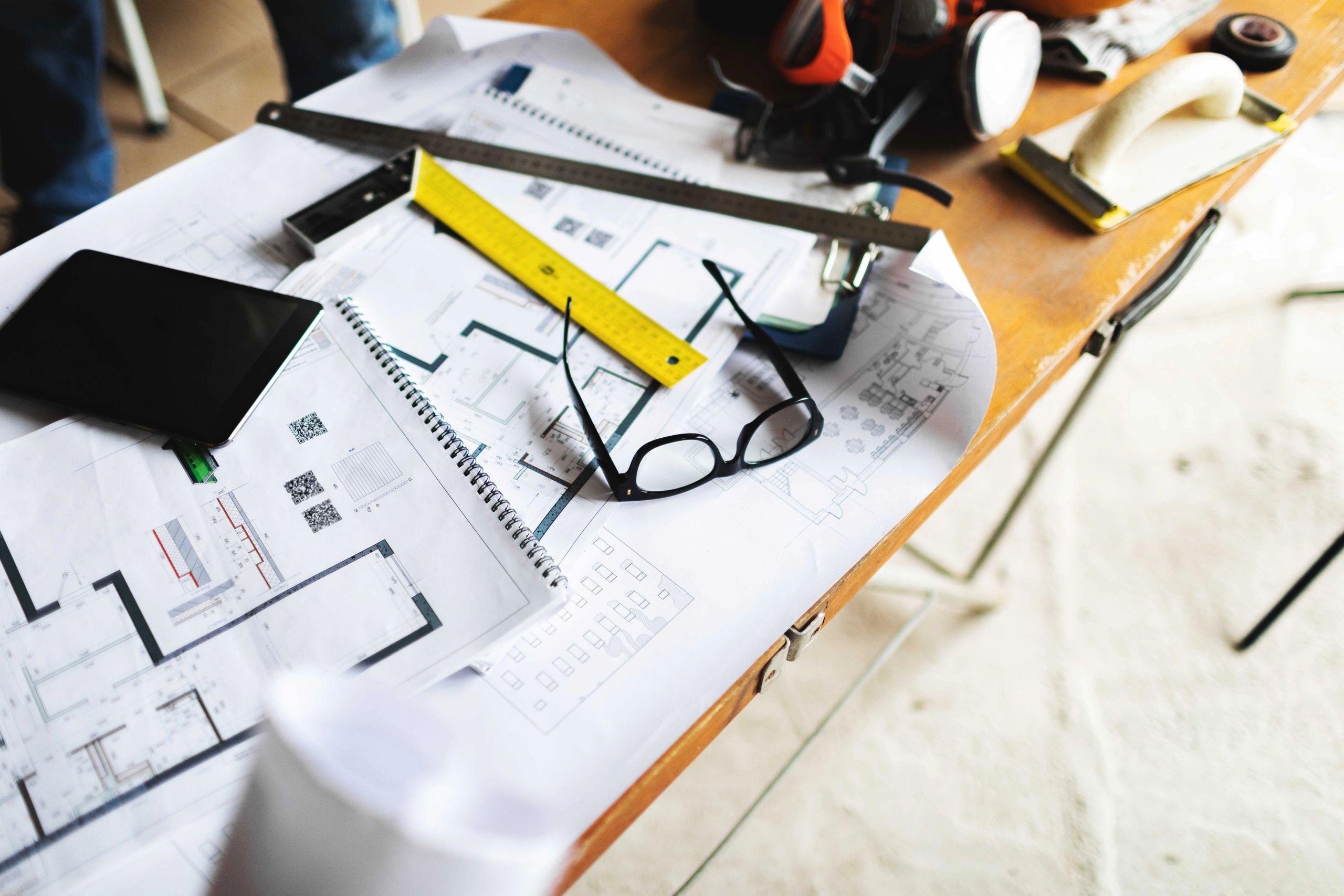Project documents and blueprints on a construction table