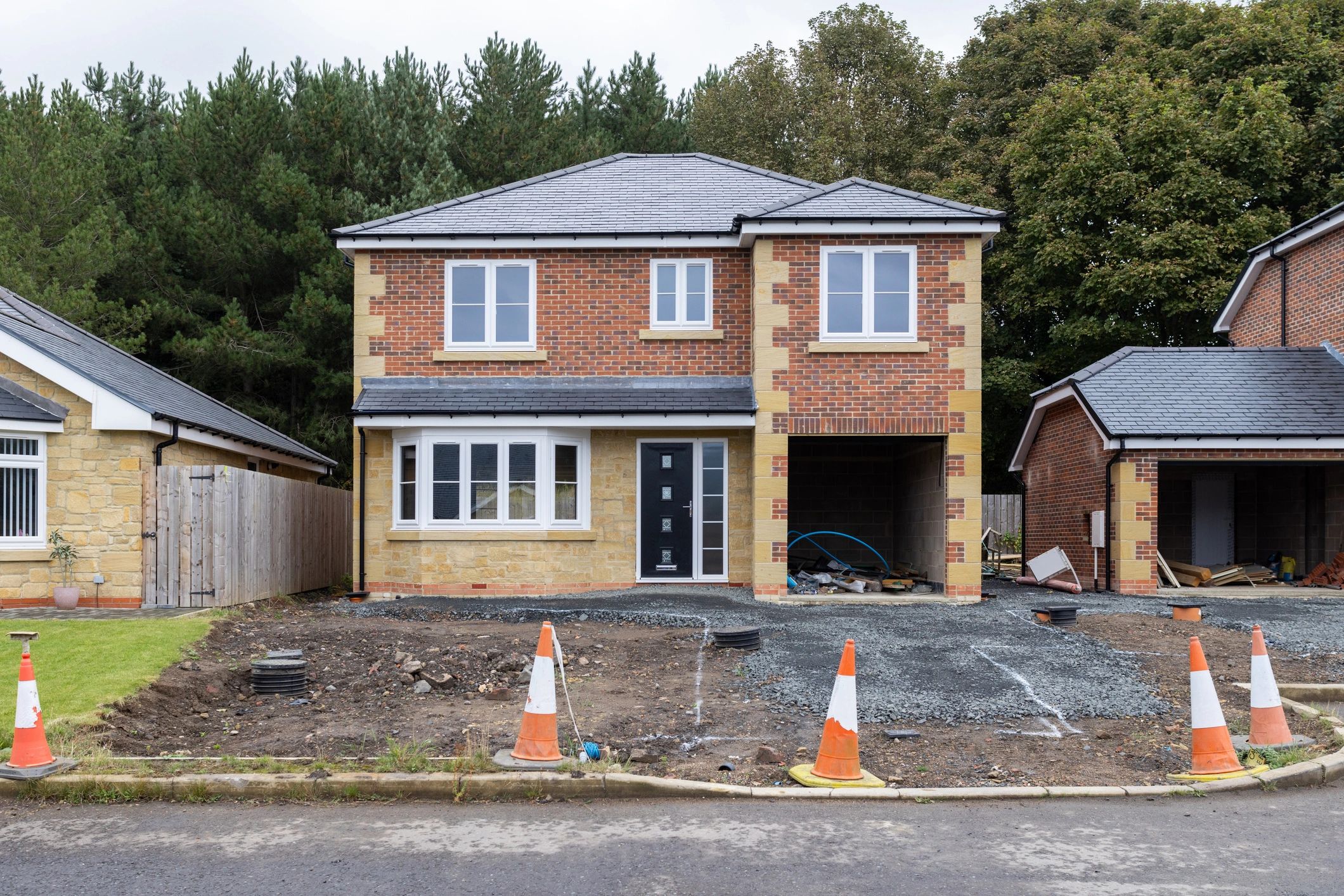 Residential home under construction with framing visible