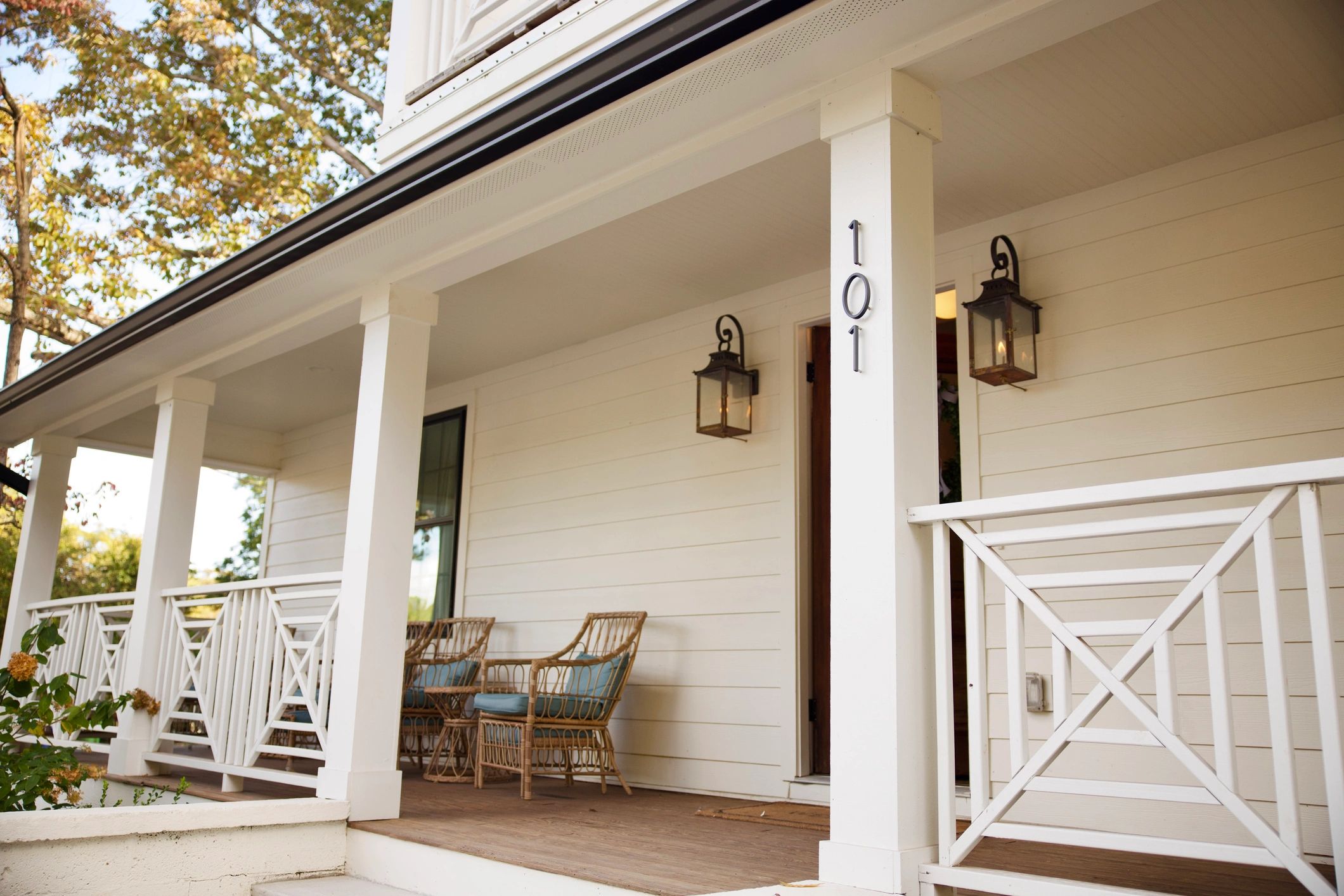 White modern farmhouse exterior with front porch